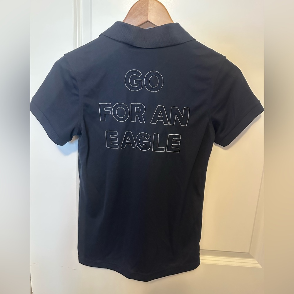 Daily Sports women’s small golf Polo. Navy. Go for an eagle graphic in back. NWT